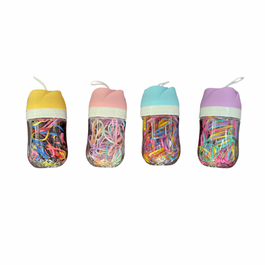 Ligas grandes elasticas plásticas suave en botellita de rosa para cabello X 12 botellitas (42A-6)